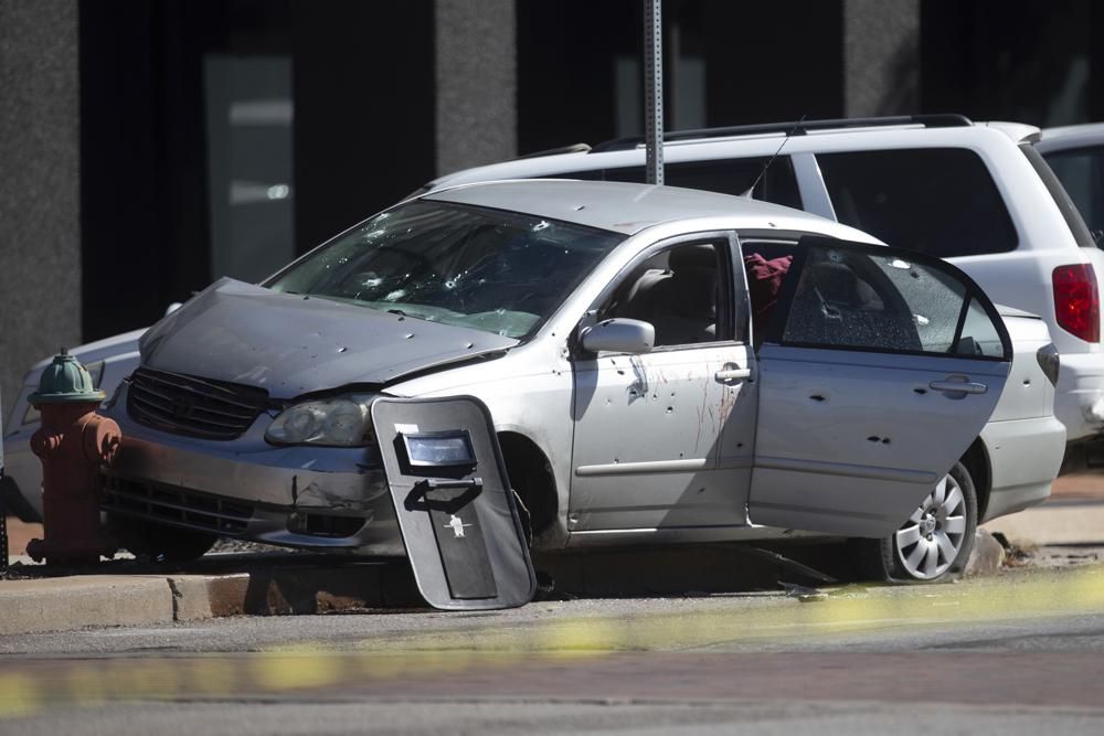 A suspect's vehicle is left riddled with bullet holes after being involved in an officer-involved shooting at the intersection of 6th St. and Kansas Ave. Thursday, Sept. 29, 2022, in downtown Topeka, Kan.