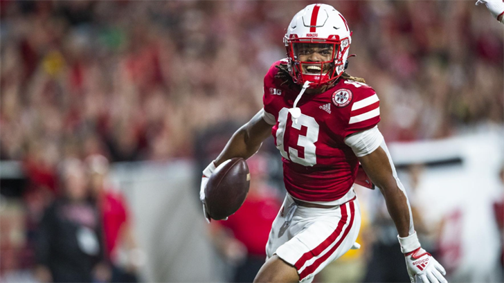 Malcolm Hartzog celebrates after scoring on a blocked punt against Indiana.