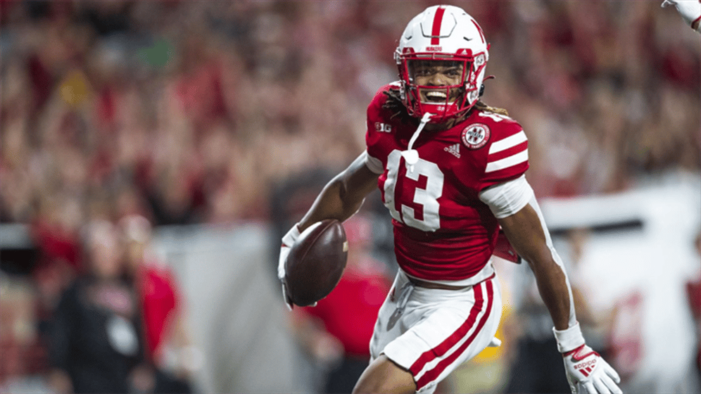Malcolm Hartzog celebrates after scoring on a blocked punt against Indiana.
