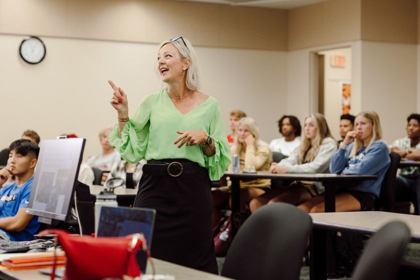 Dr. Heather Lambert, professor of psychology, works with students in a small lecture hall on Doane's Crete campus in August 2022. The university now offers dual-credit opportunities to students in high school who want to challenge themselves and experienc
