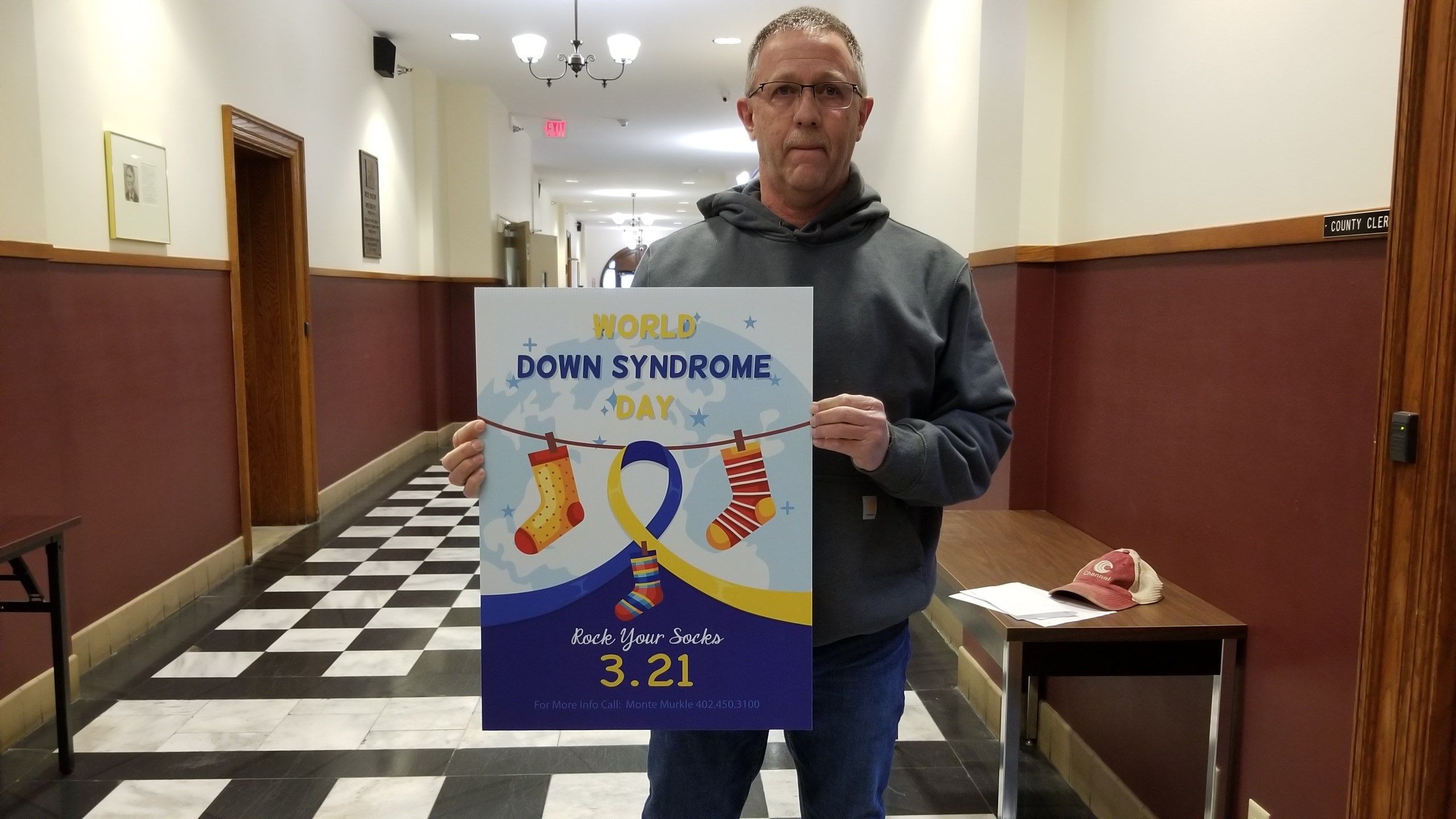 Monte Murkle, with Down Syndrome Awareness poster