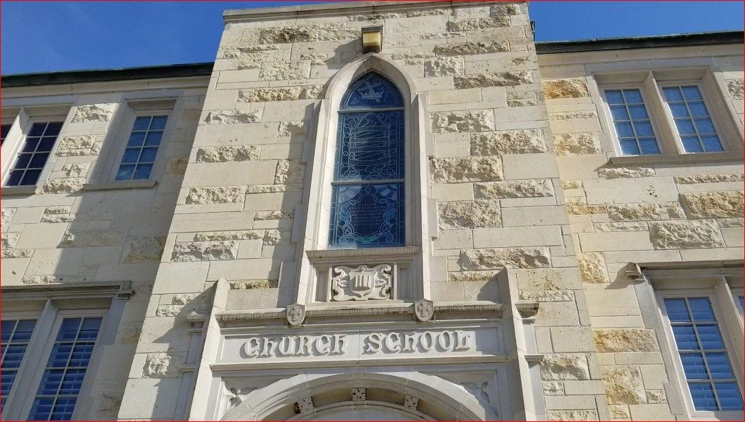 School entrance, on south side of the church