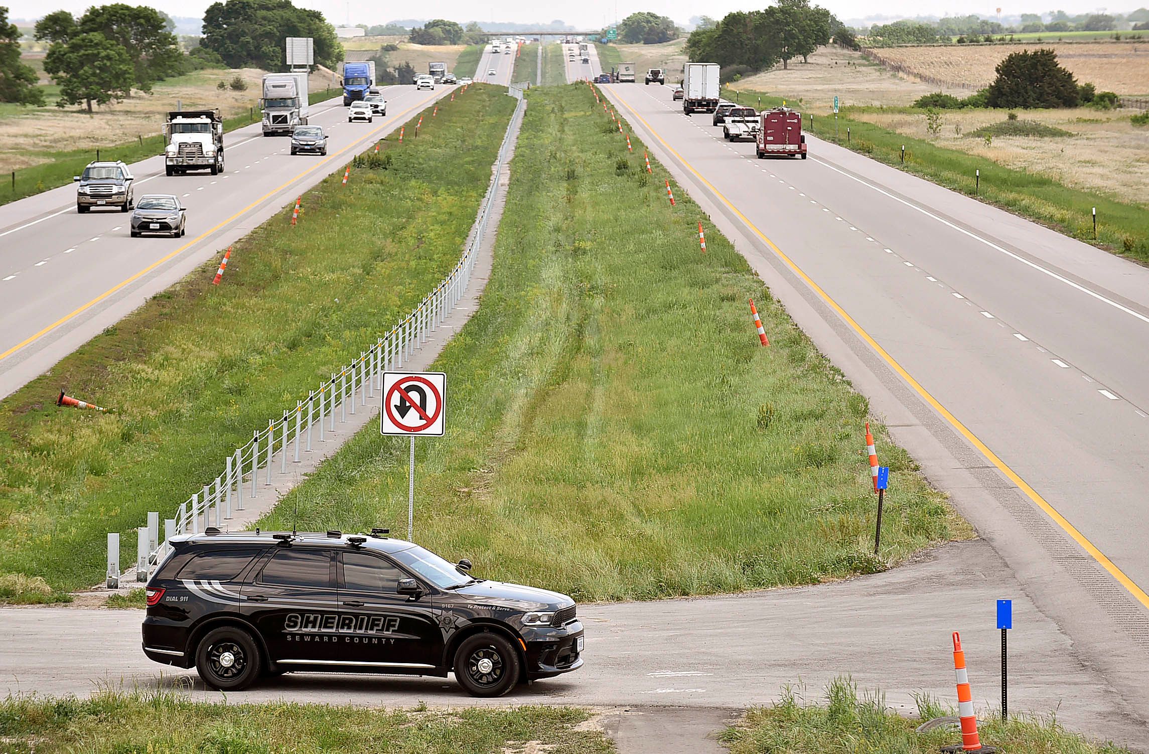 A Seward County Deputy monitors eastbound traffic on Interstate 80 in May 2023. Seward County’s 24-mile stretch of I-80 has become known, and notorious, for a type of traffic stop that the county has used to seize millions from motorists.