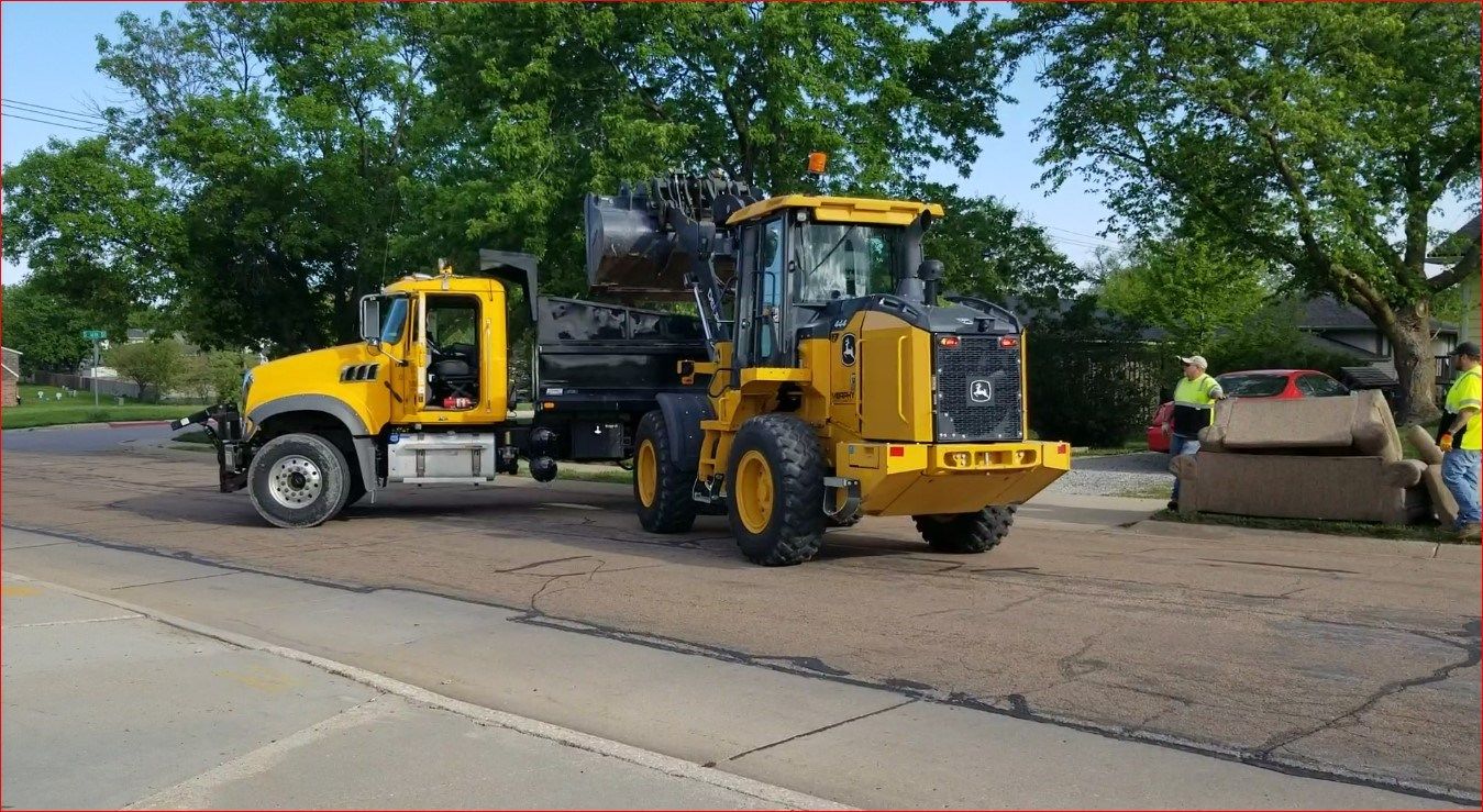 City Crews picking up items along East Scott Street